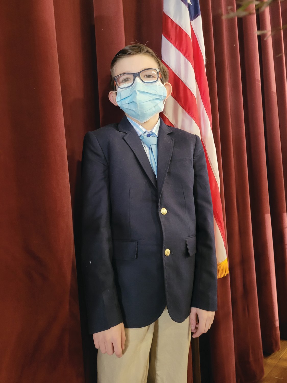Sixth-grader Allessandro Cassisi-Wood, 11, of Providence, a sixth-grader at Saint Rocco School, wore a sports coat and tie to Career Day. He wants to be President of the United States when he grows up. (Sun Rise photo by Rory Schuler)